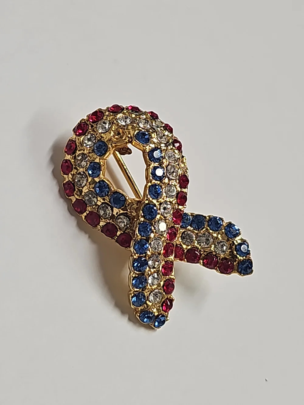 Gold-Tone Ribbon Crystal Brooch in Red, Blue, and Clear Cancer Awareness Pin